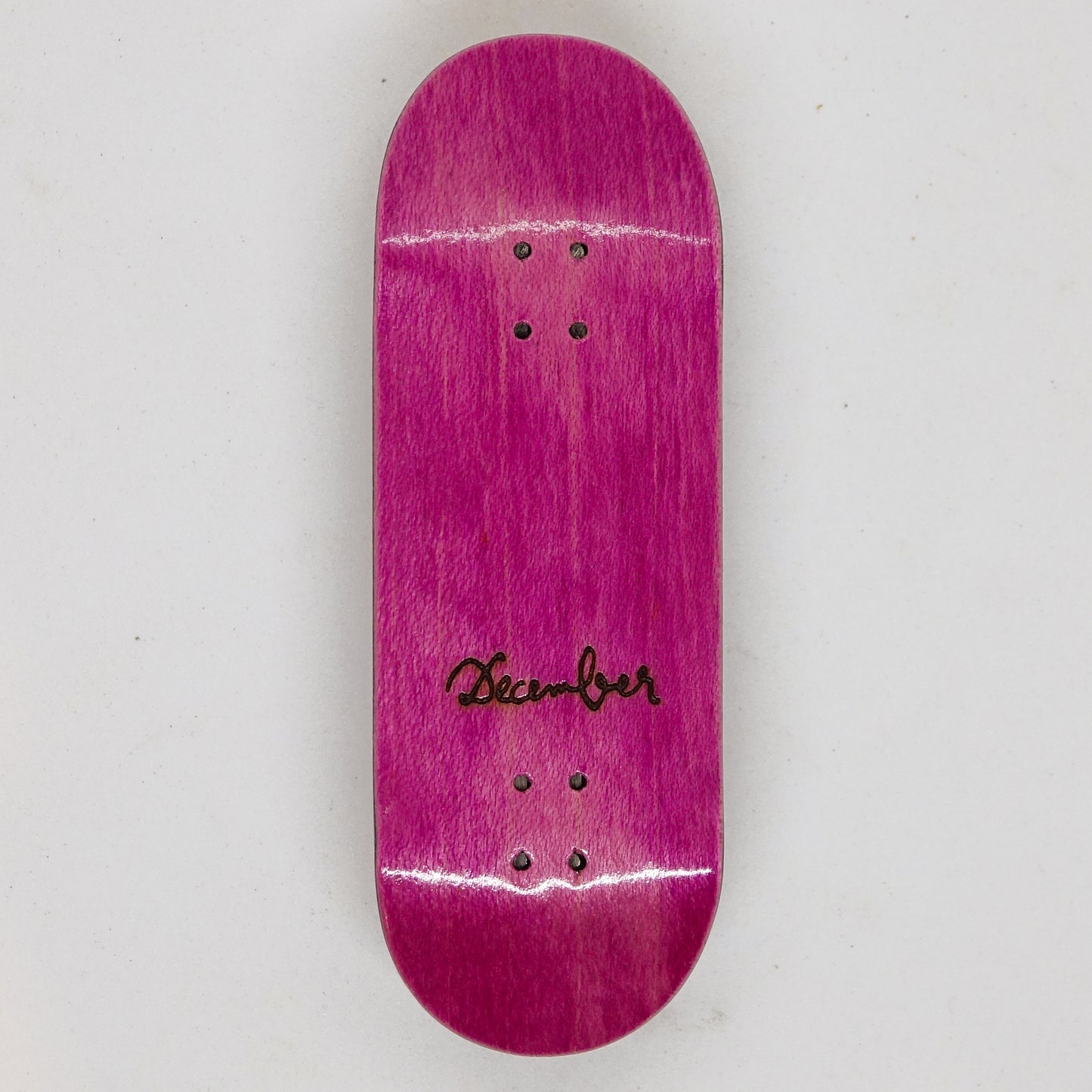 December Maple Board - December Logo